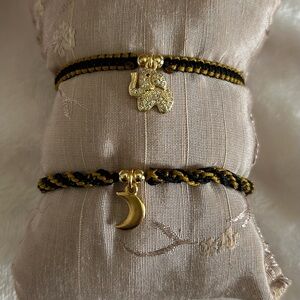 Gold and Black Charm Bracelets